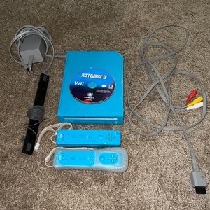 Blue Nintendo Wii console with controllers and Just dance game
